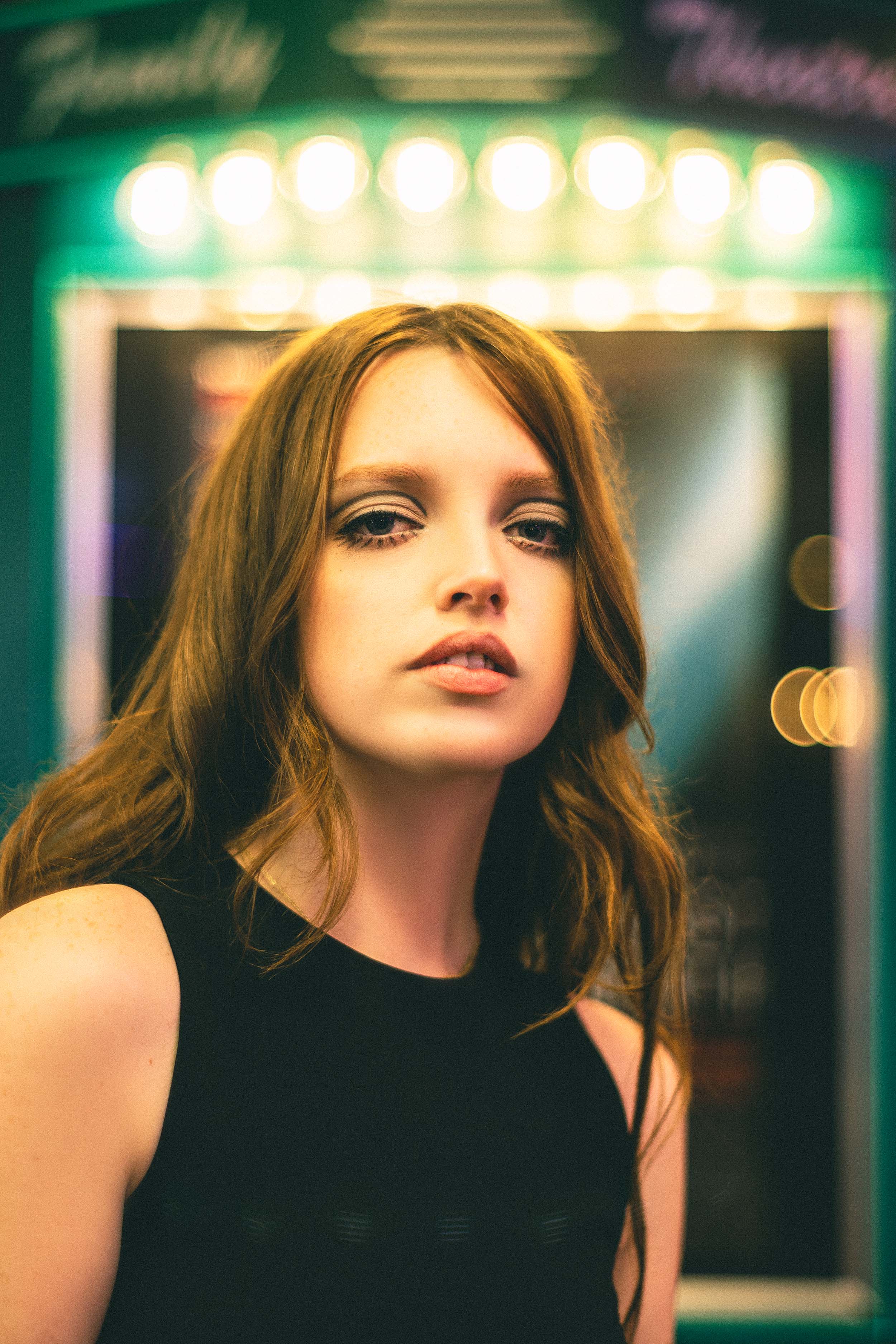 Cinematic Portraits with Vintage Flair by a Movie Theater — photograph 2 of 35